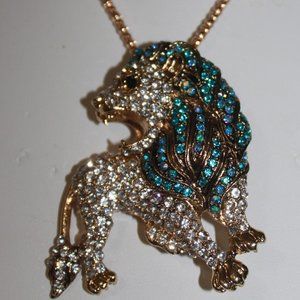 Clear Crystal & Blue Crystal make up this Lion Necklace